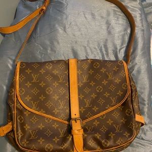 Louis. Vuitton Cross Body Bag and laptop bag.